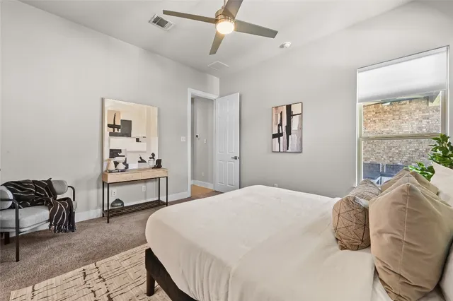 a bedroom with a bed and a table