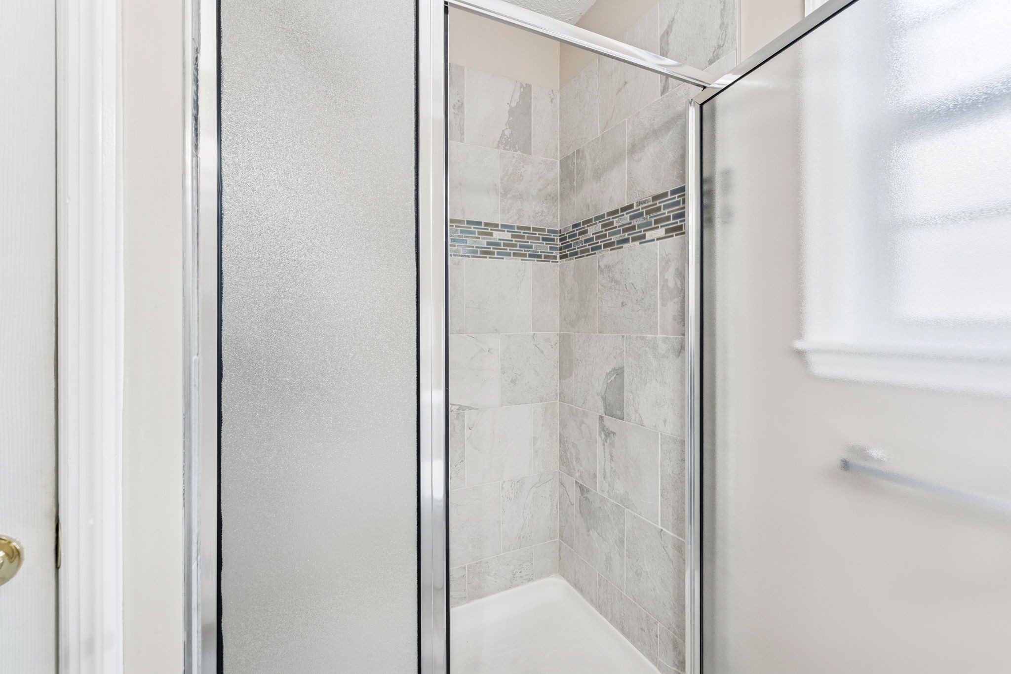 7399 Forest Glenn Road Fairview, TN 37062 - Photo 41 of 75 a bathroom with a glass shower door
