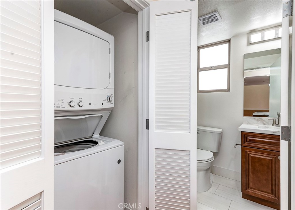 596 South Brea Boulevard Brea, CA 92821 - Photo 16 of 33 a bathroom with a toilet a sink and a window