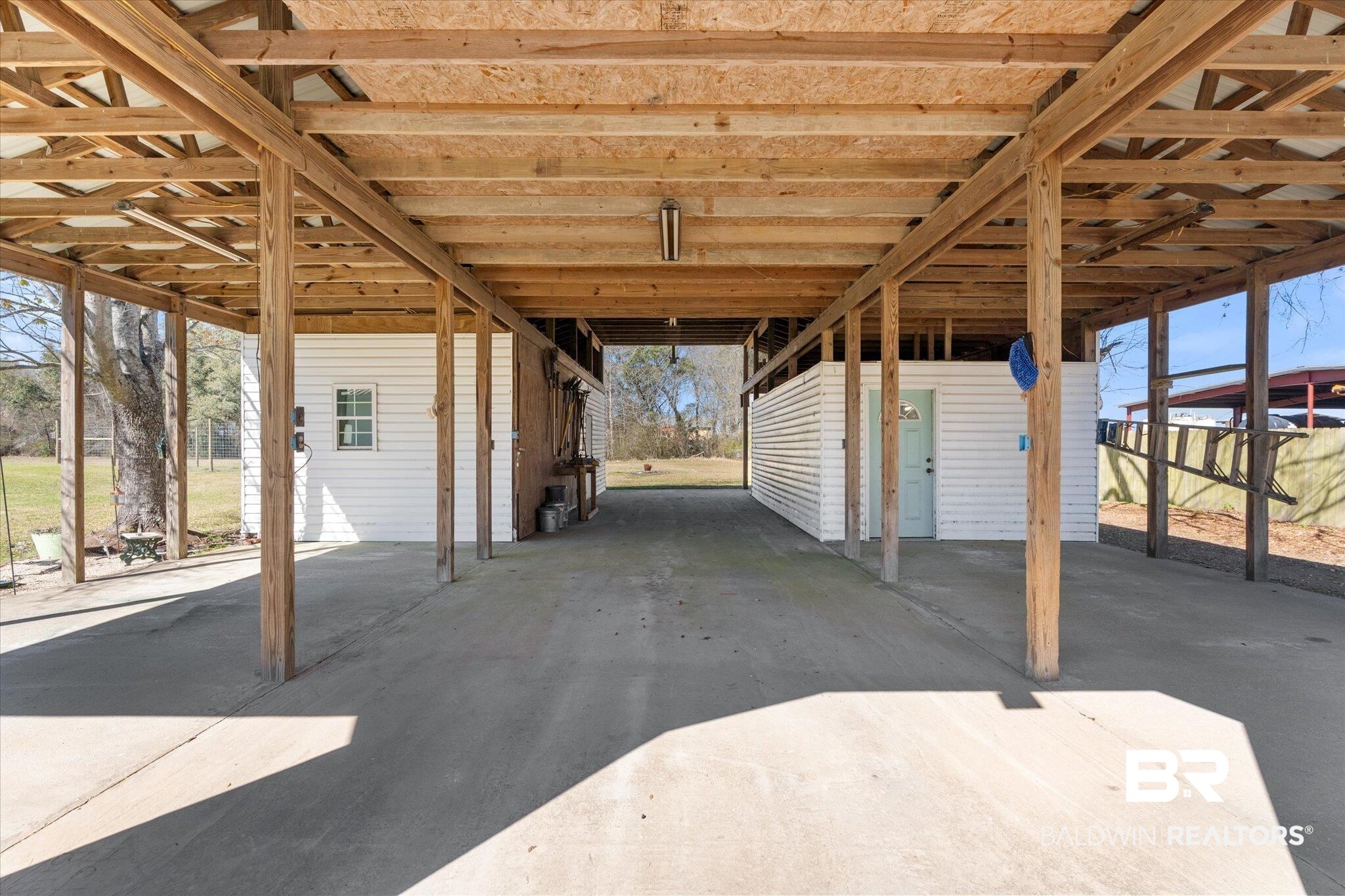 14280 Cat Deakle Road Grand Bay, AL 36541 - Photo 31 of 51 View of patio with an attached carport and an outdoor structure