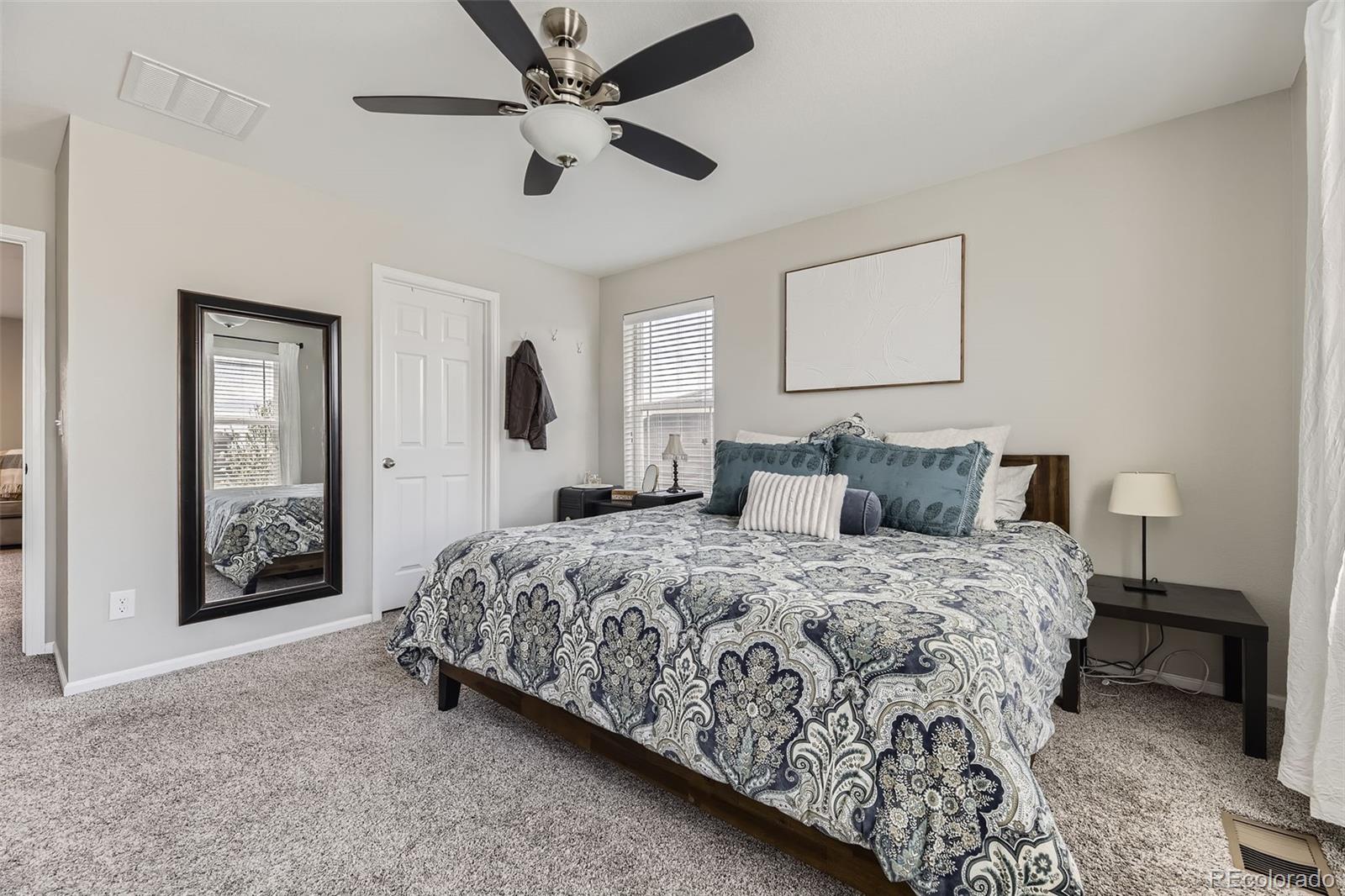 25621 East Cedar Place Aurora, CO 80018 - Photo 14 of 30 a bedroom with bed and window