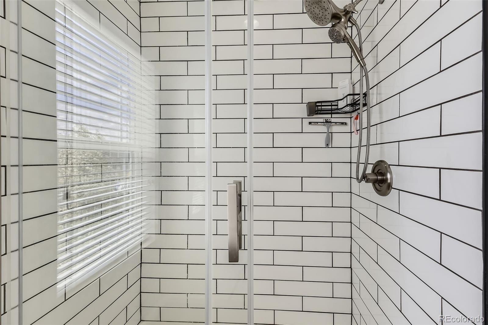 25621 East Cedar Place Aurora, CO 80018 - Photo 17 of 30 a bathroom with a shower