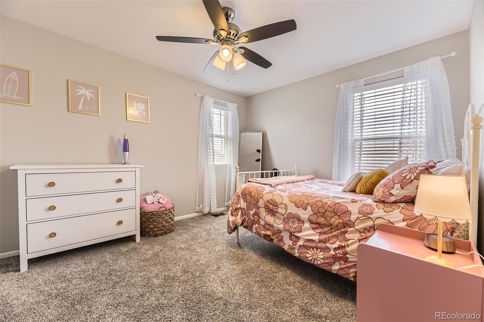 25621 East Cedar Place Aurora, CO 80018 - Photo 18 of 30 a bedroom with a bed and a ceiling fan