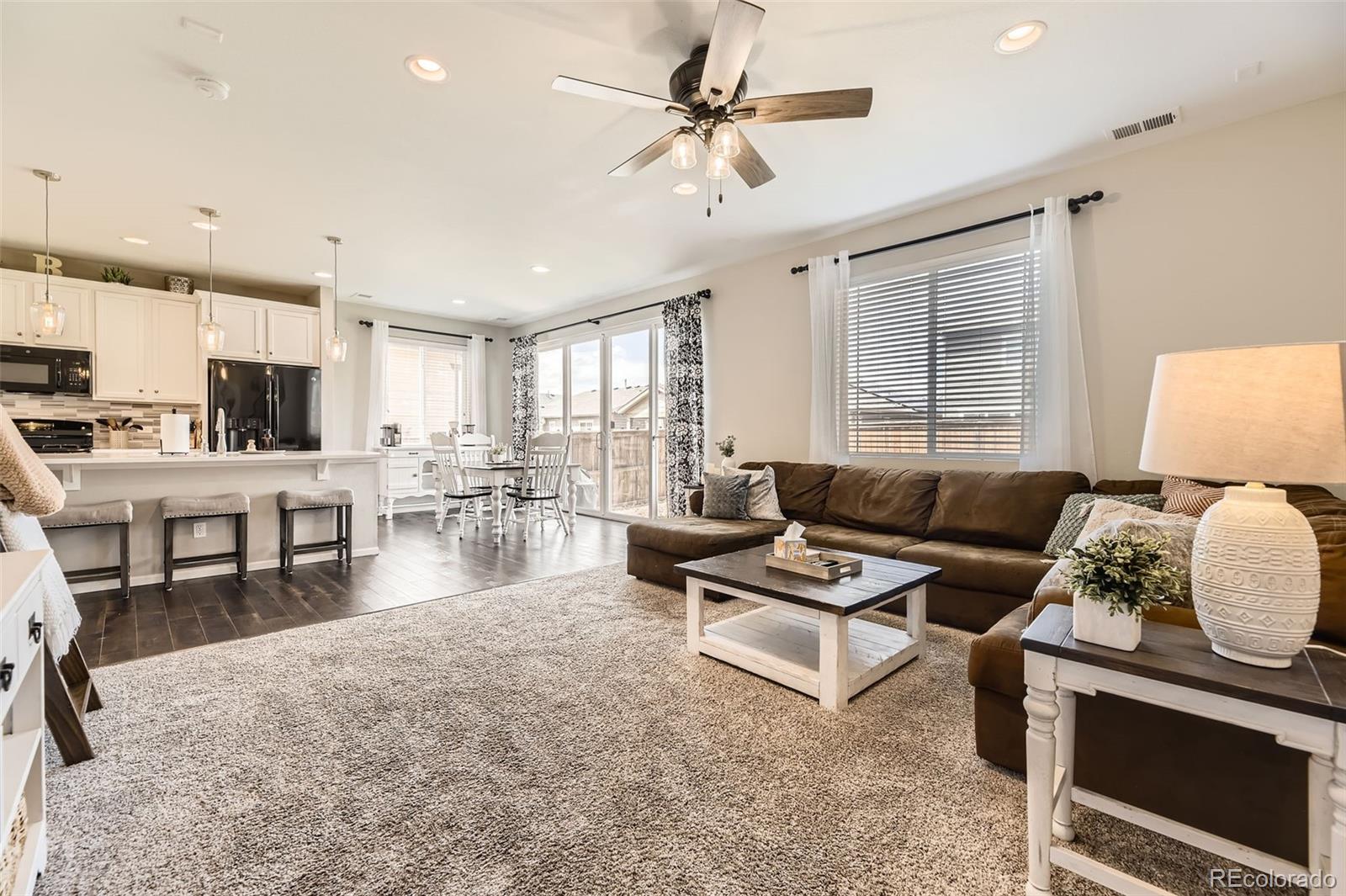 25621 East Cedar Place Aurora, CO 80018 - Photo 10 of 30 a living room with furniture and a window