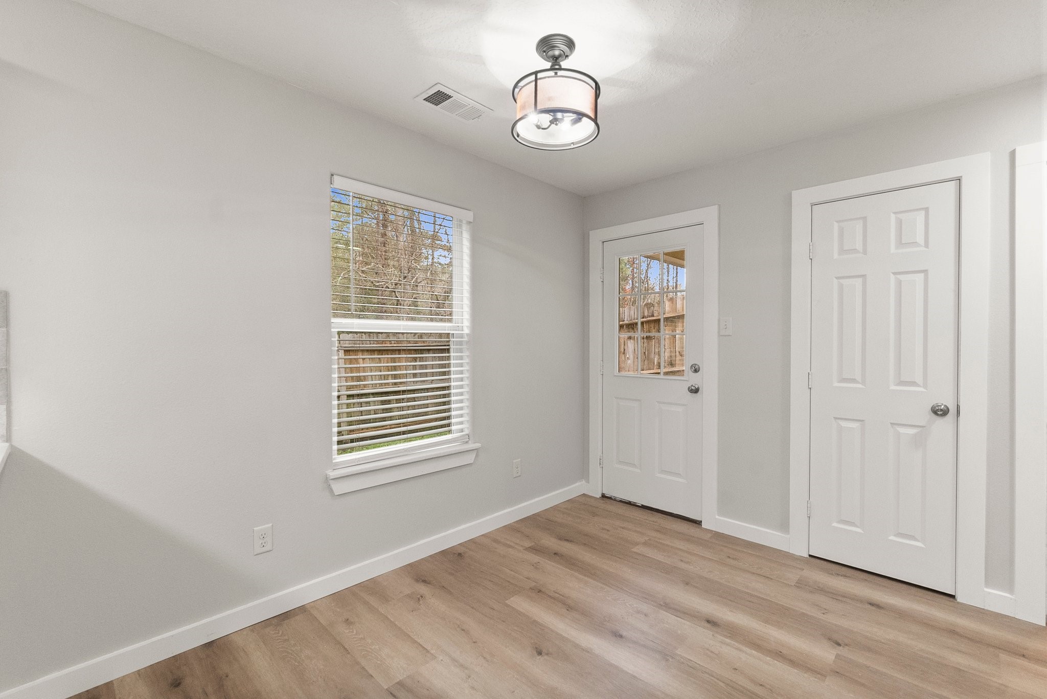 1799 League Line Road, Unit 4 Conroe, TX 77304 - Photo 12 of 34 a view of an empty room with a window