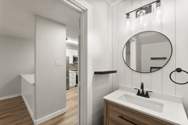 a view of an entryway with wooden floor