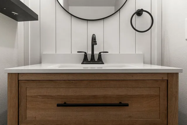 a bathroom with a sink and a mirror