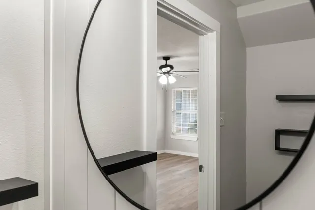 a view of an empty room with a window