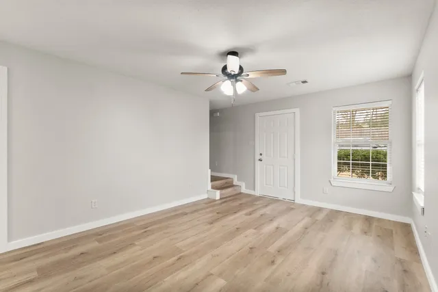 a view of an empty room with a window