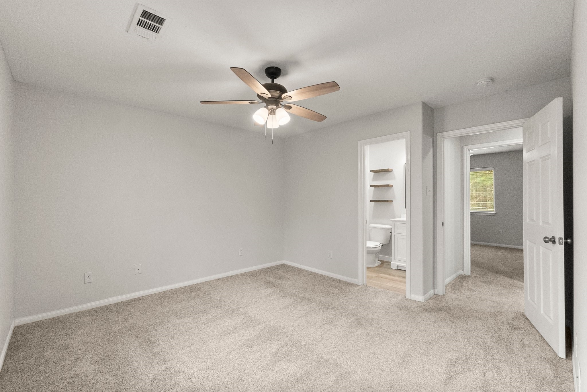 1799 League Line Road, Unit 4 Conroe, TX 77304 - Photo 22 of 34 a view of an empty room with a ceiling fan