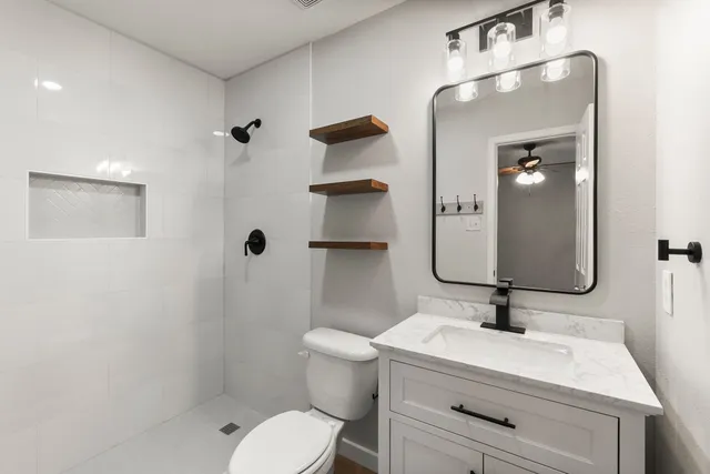 a bathroom with a sink a toilet and a bathtub