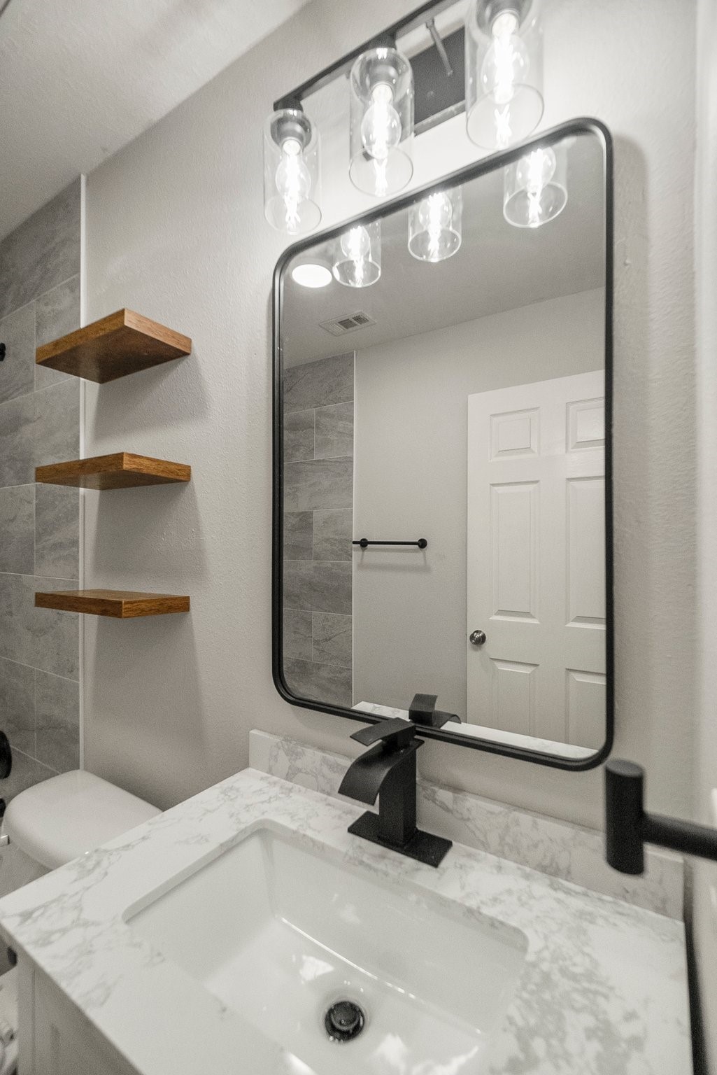 1799 League Line Road, Unit 4 Conroe, TX 77304 - Photo 29 of 34 a bathroom with a sink and a mirror
