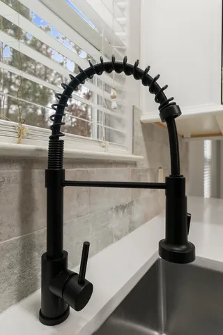 a kitchen with granite countertop cabinets and steel stainless steel appliances