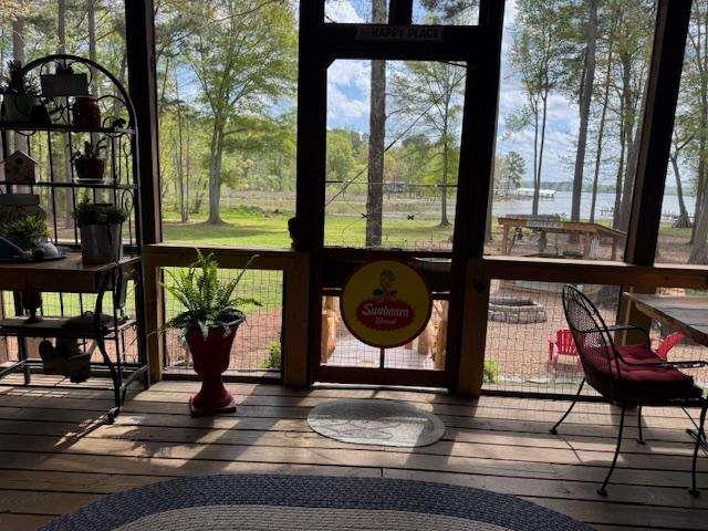 500 County Road 496 Centre, AL 35960 - Photo 35 of 44 a living room with wooden floor and a floor to ceiling window