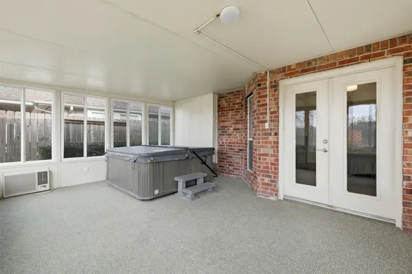 a living room with furniture windows and a ceiling fan