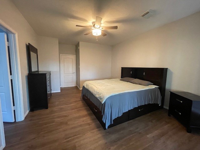 2202 Melanie Park Drive Spring, TX 77388 - Photo 17 of 21 a spacious bedroom with a bed and a chandelier