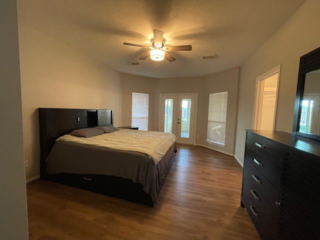 2202 Melanie Park Drive Spring, TX 77388 - Photo 19 of 21 a bedroom with a large bed and a chandelier