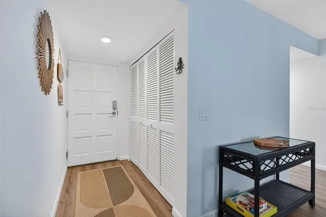 a view of a hallway to rooms