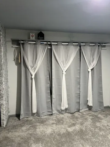 a view of walk in closet with window