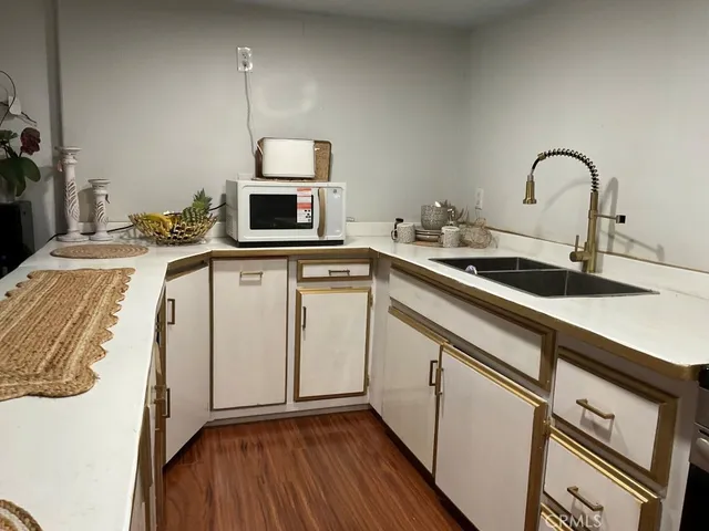 a kitchen with a sink and cabinets