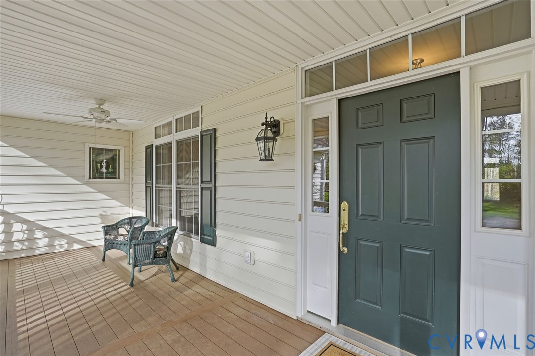 14430 Overlook Ridge Lane Beaverdam, VA 23015 - Photo 15 of 71 a view of a house with a door and wooden bench