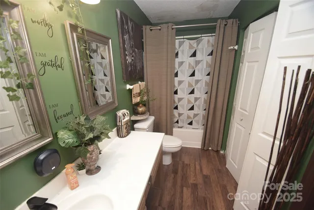 a bath room with a sink and a mirror
