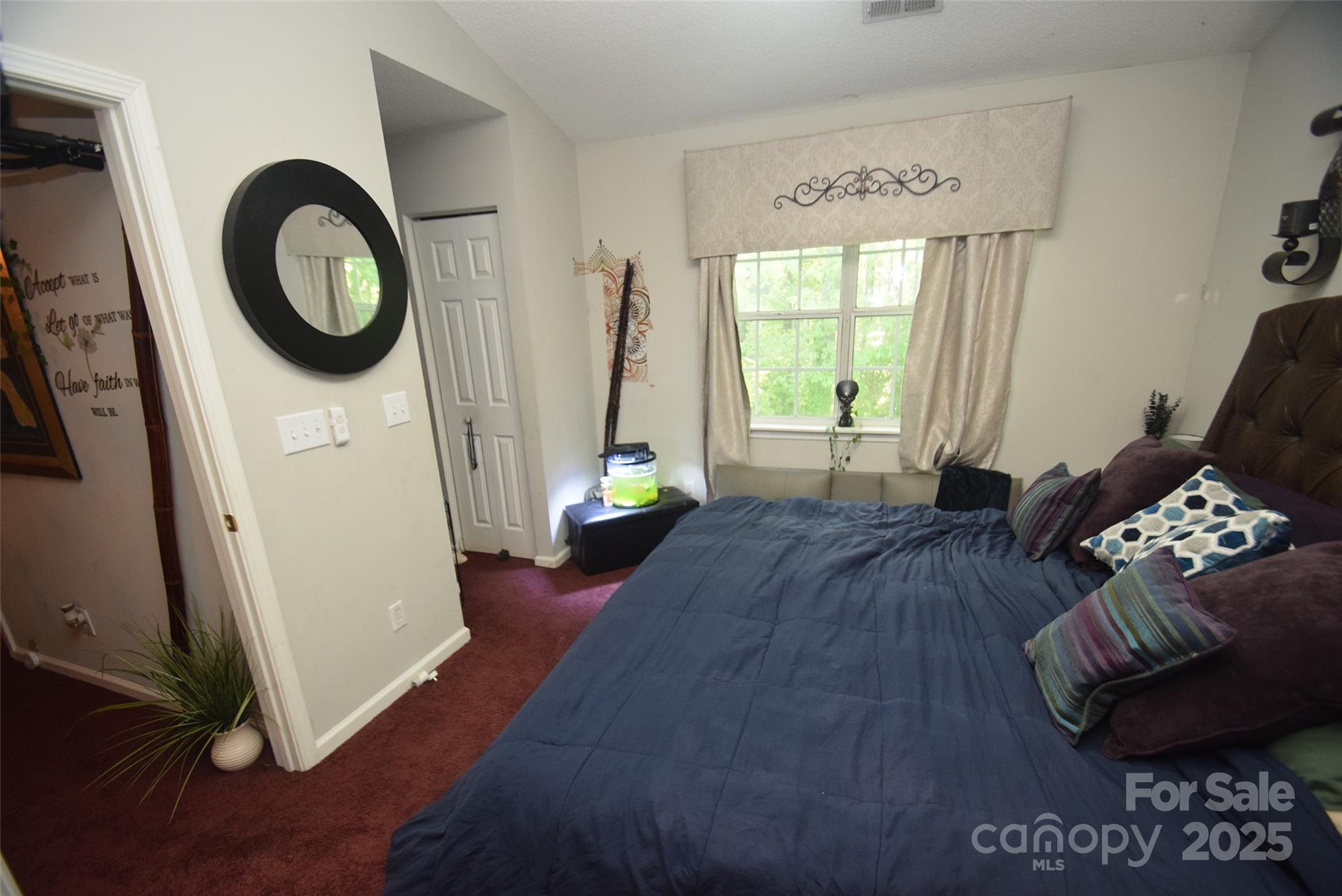 11130 Whitlock Crossing Court Charlotte, NC 28273 - Photo 18 of 27 a bedroom with a bed and a large window