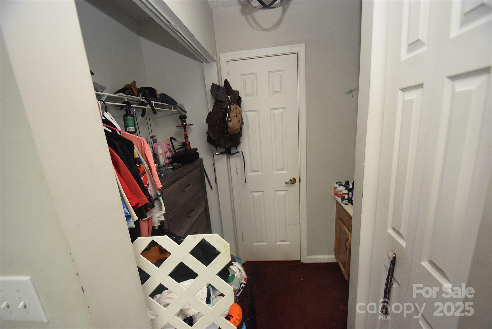 11130 Whitlock Crossing Court Charlotte, NC 28273 - Photo 20 of 27 a view of walk in closet with clothes