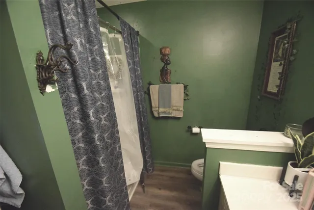 a bathroom with a toilet and shower