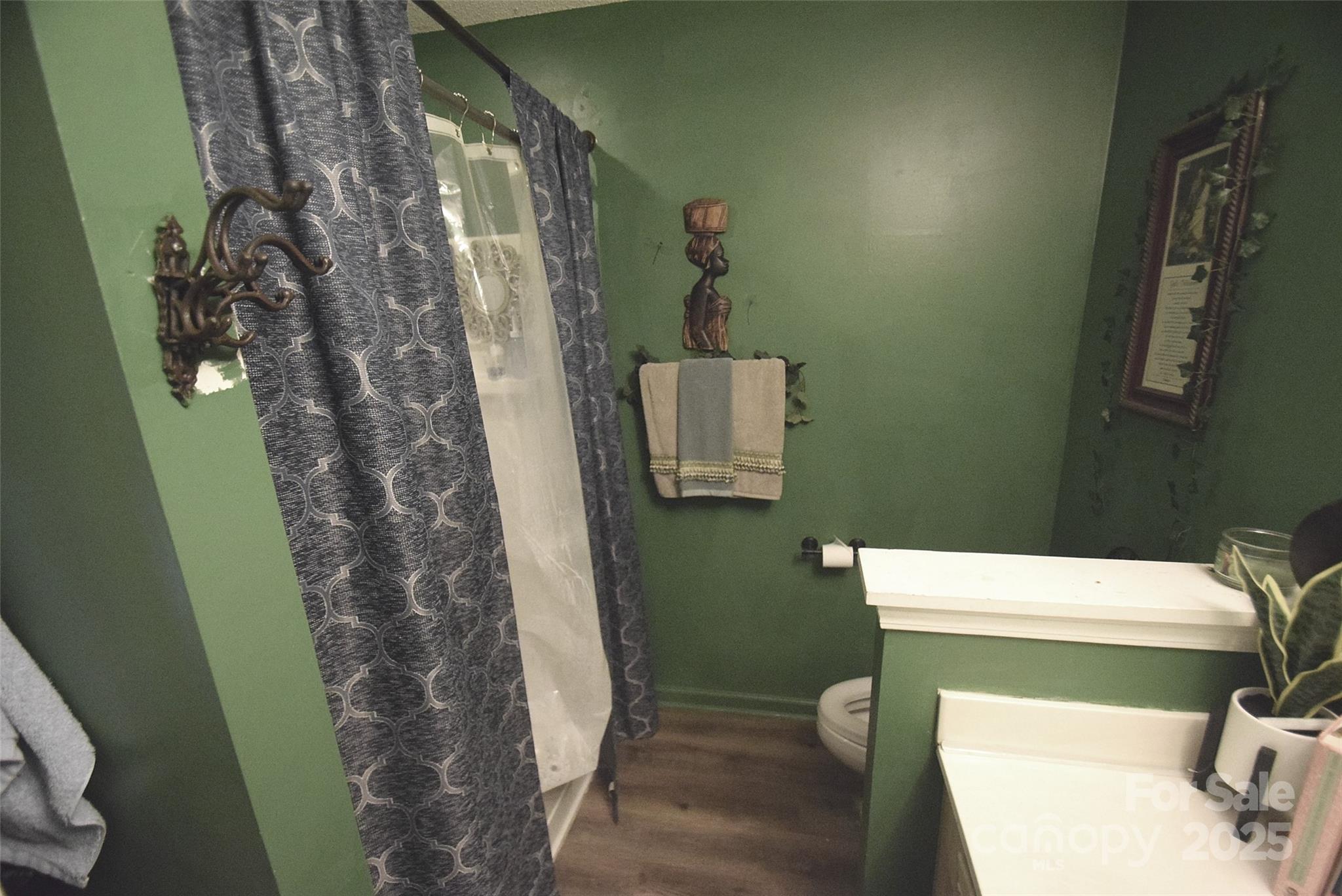 11130 Whitlock Crossing Court Charlotte, NC 28273 - Photo 22 of 27 a bathroom with a toilet and shower