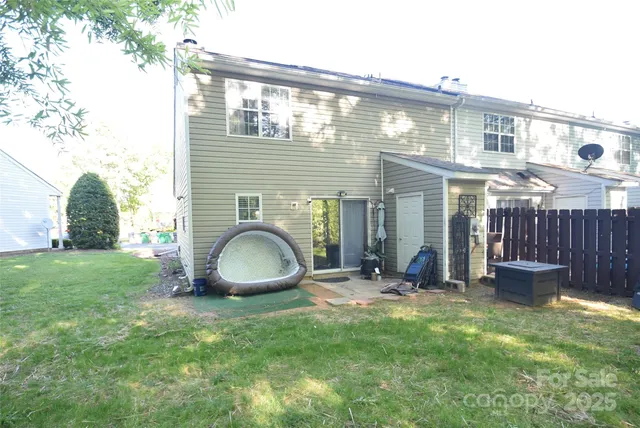 a front view of a house with a yard and seating space