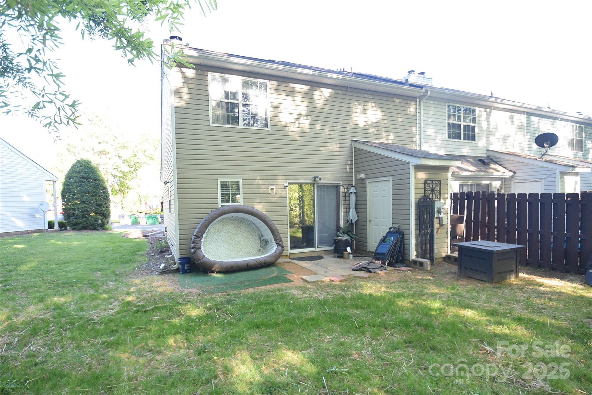11130 Whitlock Crossing Court Charlotte, NC 28273 - Photo 24 of 27 a front view of a house with a yard and seating space