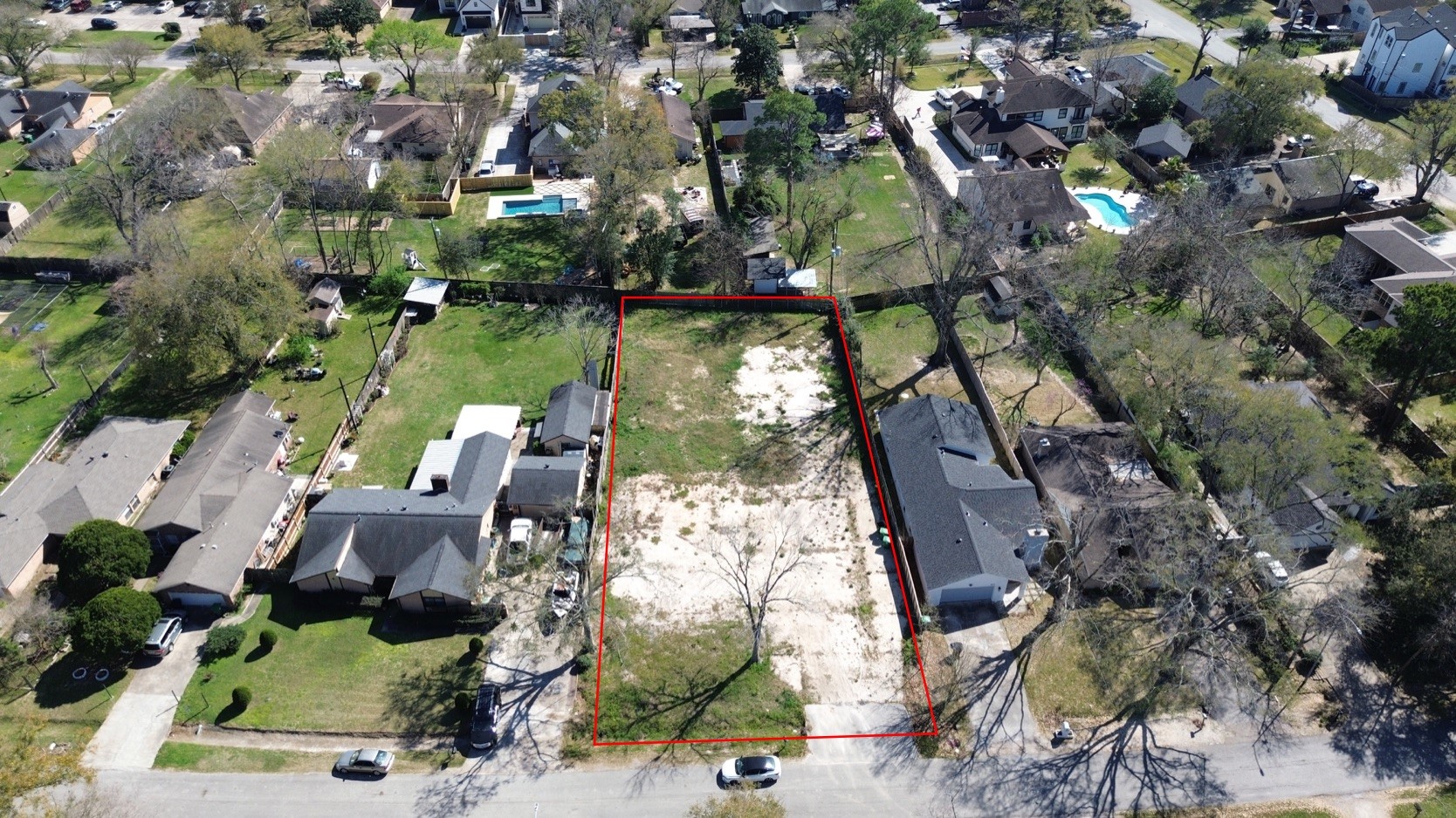 an aerial view of residential houses with outdoor space