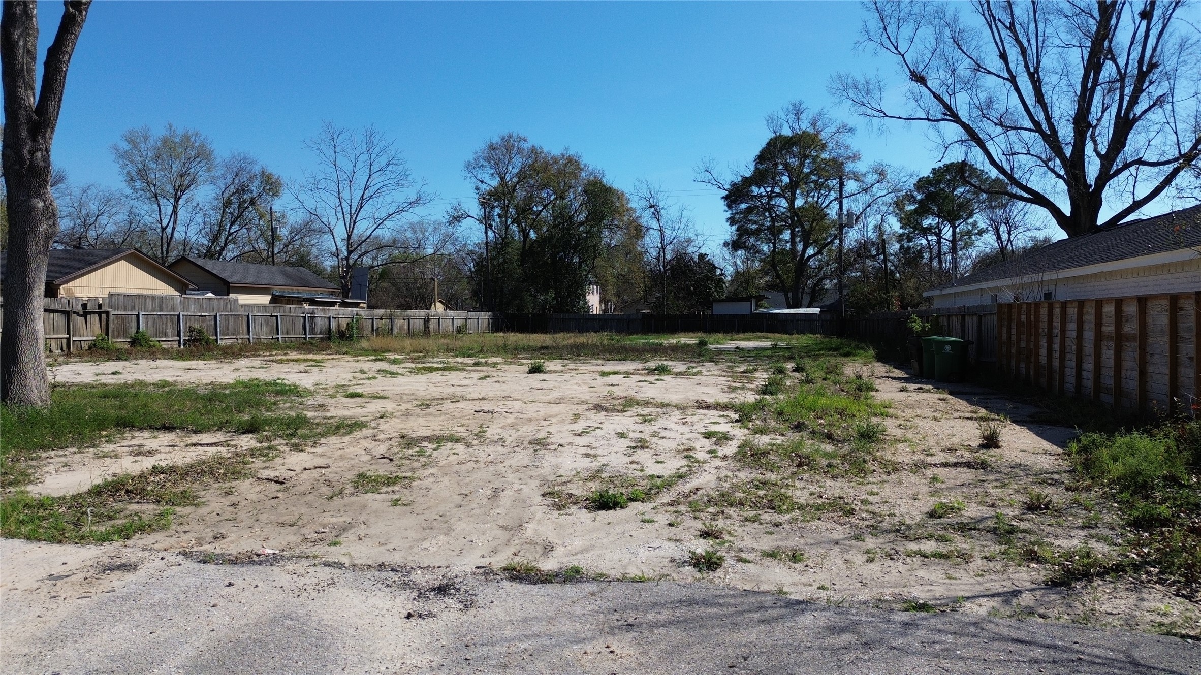 9309 Carousel Lane Houston, TX 77080 - Photo 6 of 8 a view of a yard with wooden fence