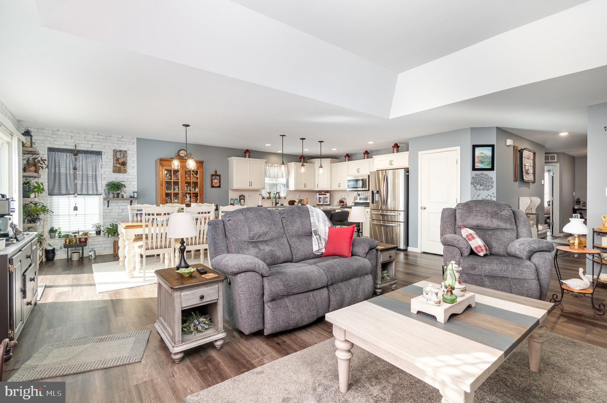 506 Granite Run Carlisle, PA 17015 - Photo 13 of 37 a living room with furniture and a wooden floor