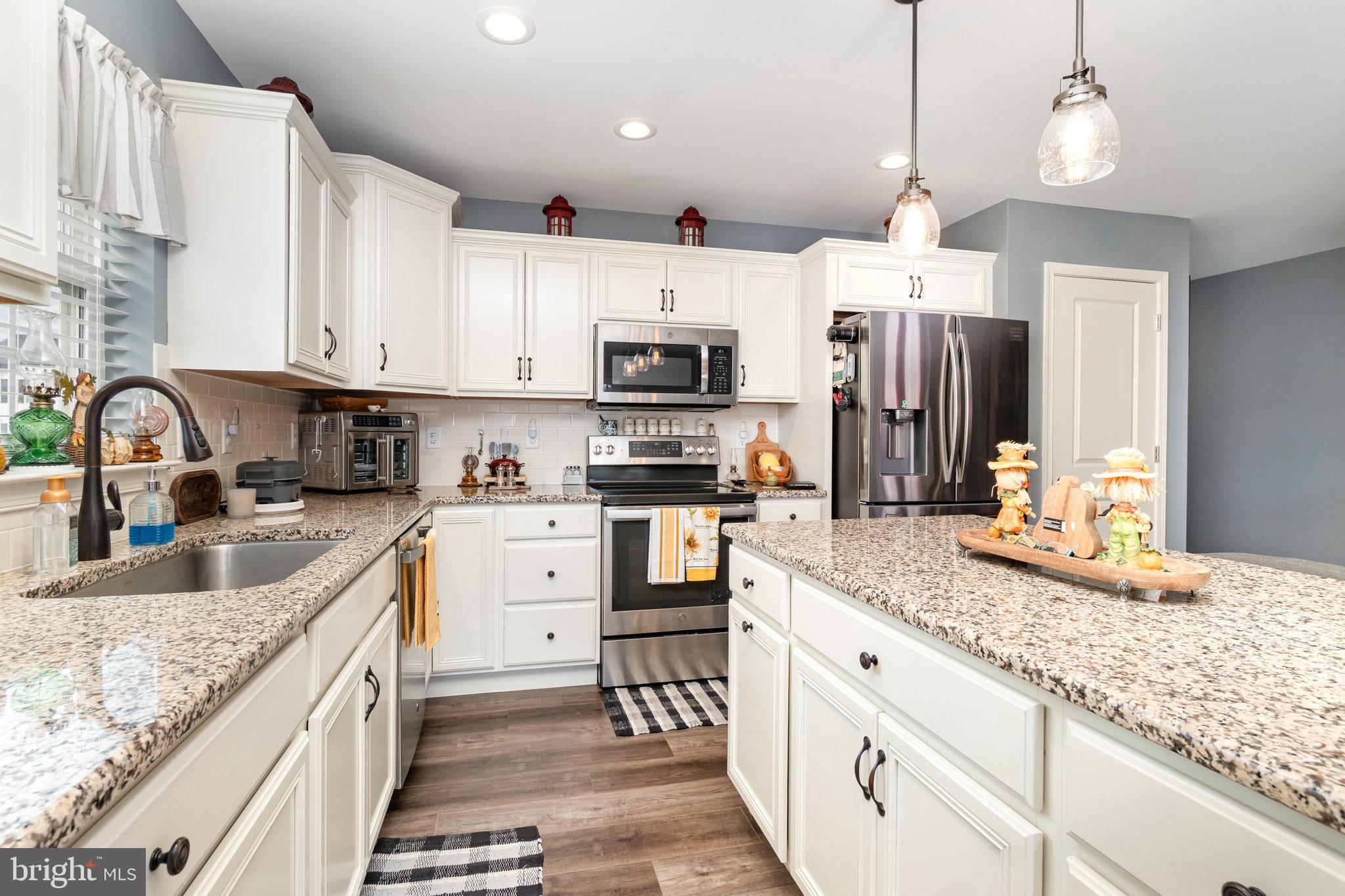 506 Granite Run Carlisle, PA 17015 - Photo 15 of 37 a kitchen with granite countertop a sink and steel appliances