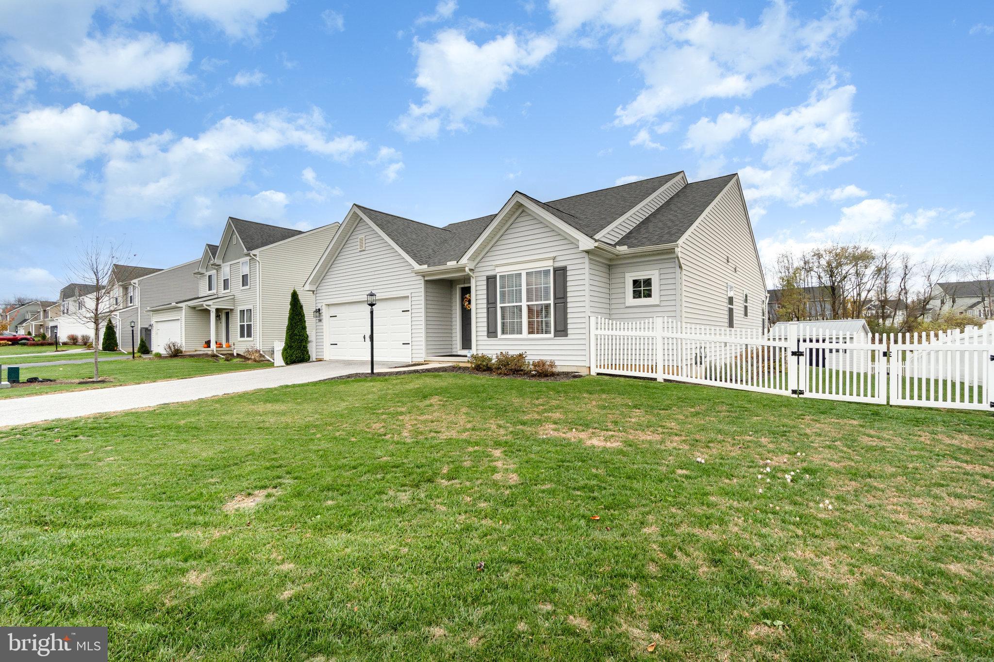 506 Granite Run Carlisle, PA 17015 - Photo 3 of 37 a view of a house with a big yard potted plants and large tree