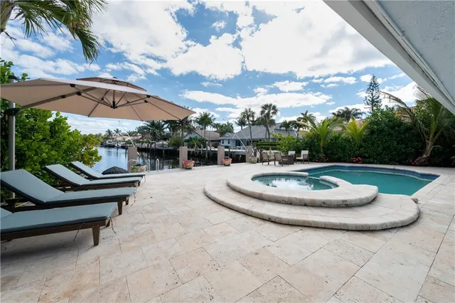 a view of a backyard with sitting area