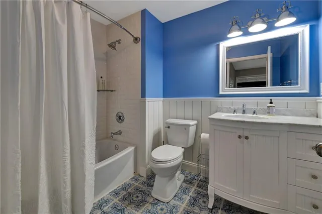 a view of a livingroom with workspace and a window