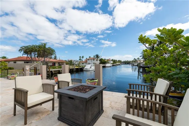 a terrace of a house with outdoor seating