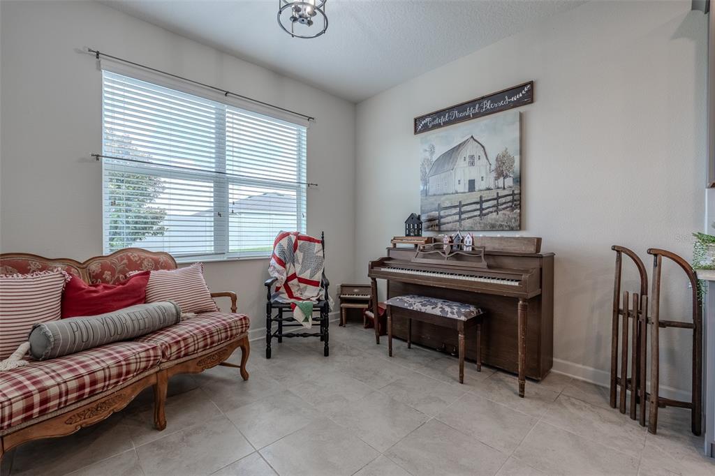 9224 Southwest 60th Ct Road Ocala, FL 34476 - Photo 17 of 55 a living room with furniture and a window