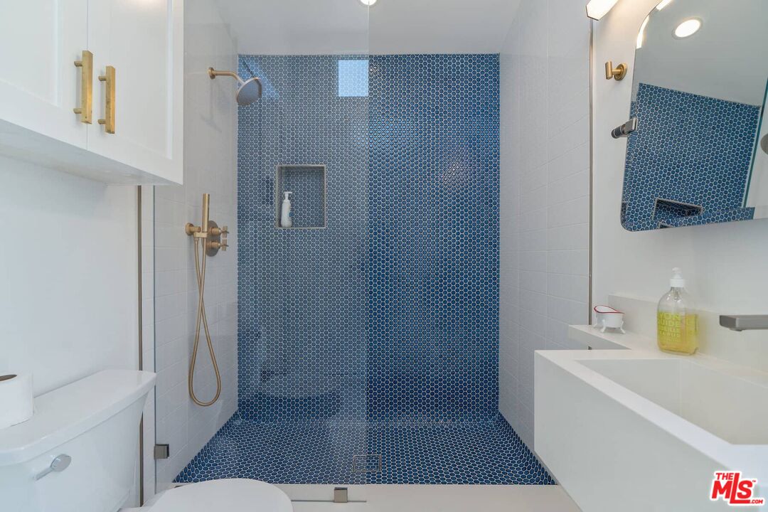 249 Paradise Cove Road Malibu, CA 90265 - Photo 26 of 41 a bathroom with a tub shower and sink