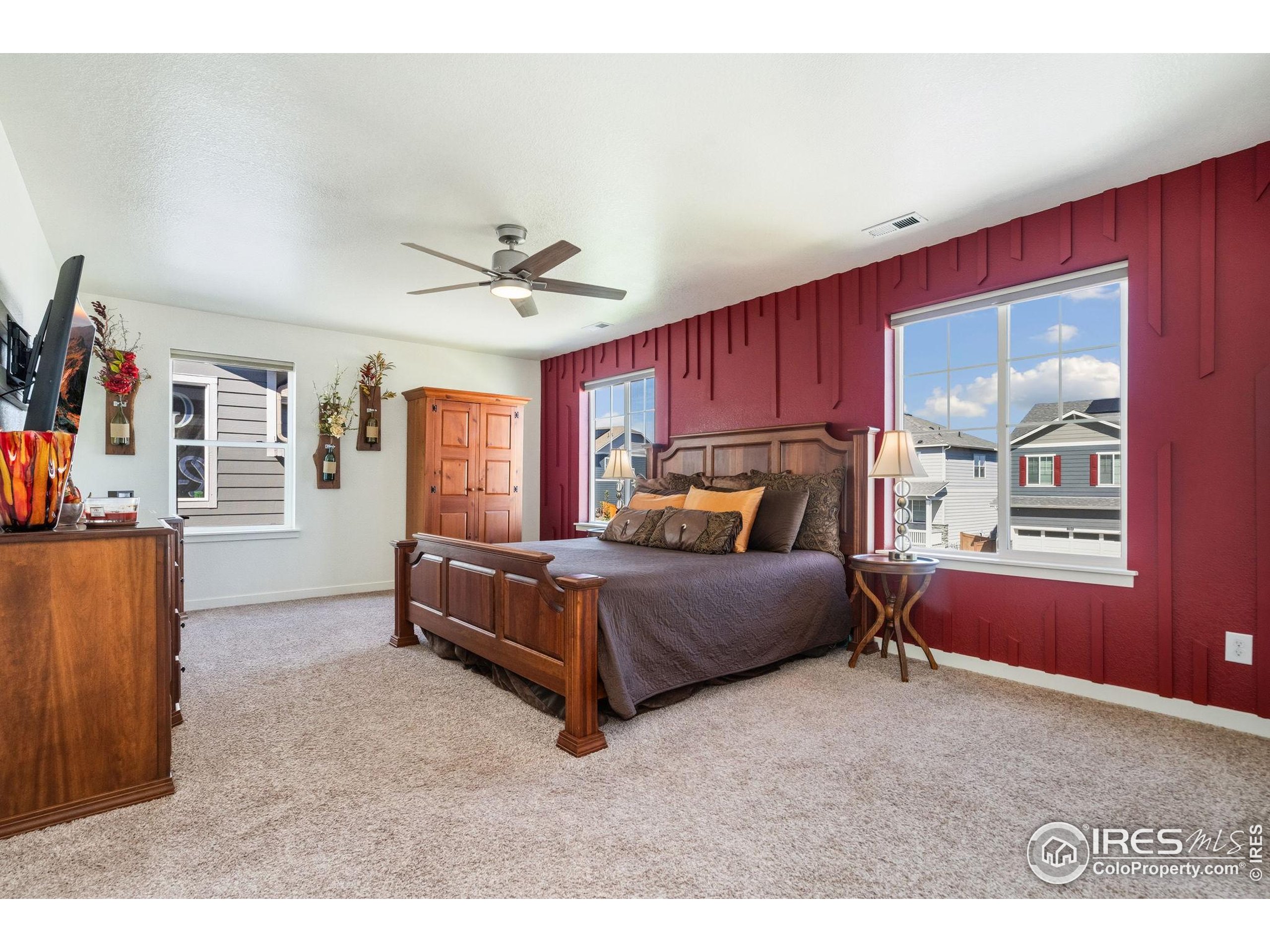 1233 Lily Mountain Road Severance, CO 80550 - Photo 20 of 44 a bedroom with a bed and a window