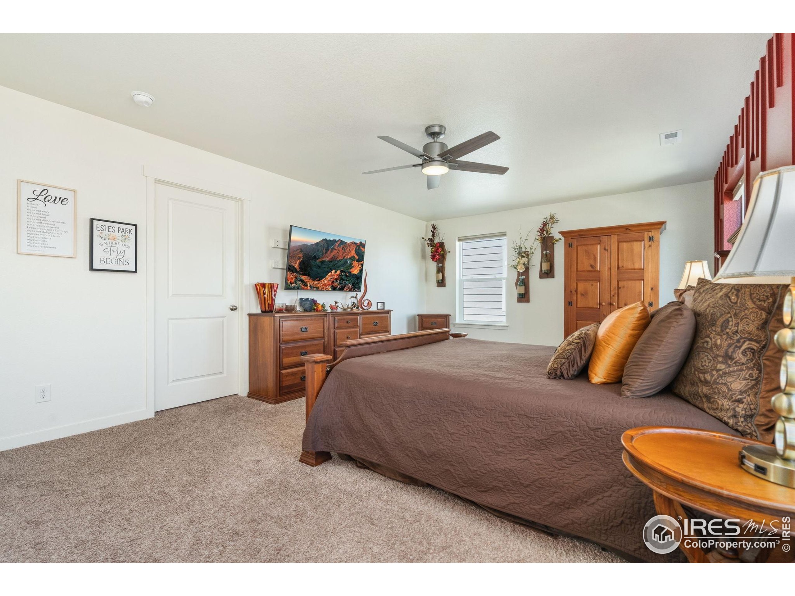 1233 Lily Mountain Road Severance, CO 80550 - Photo 21 of 44 a bedroom with a bed and dresser
