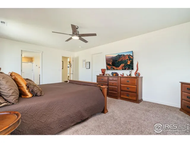 a bedroom with a bed and dresser