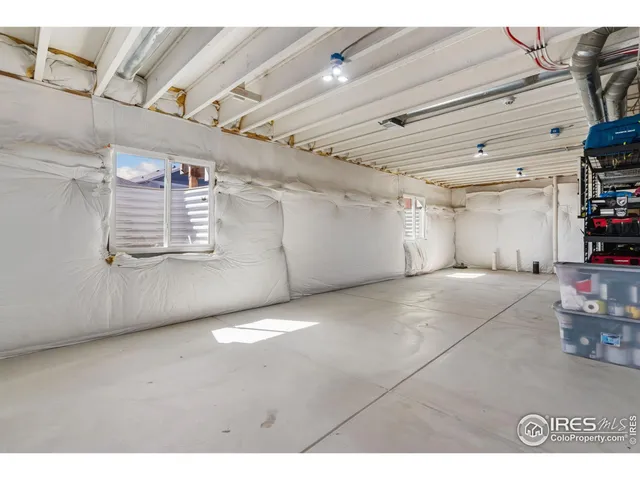 a view of empty room with wooden ceiling
