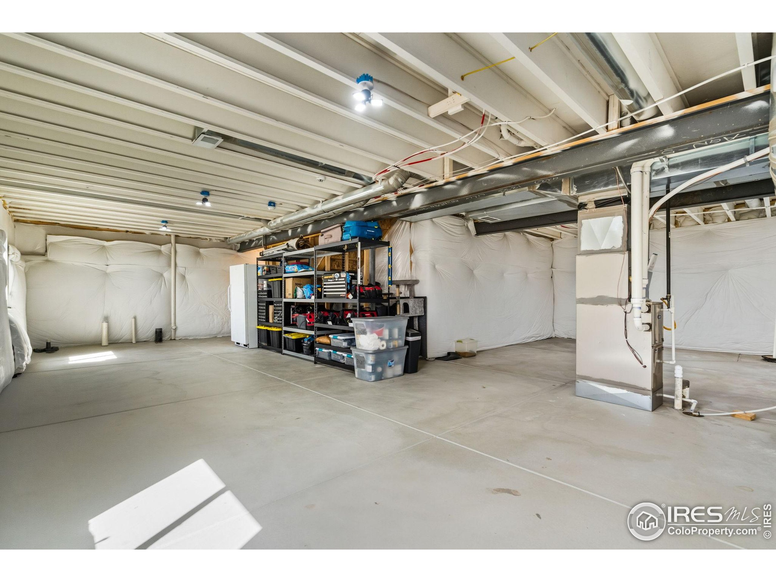 1233 Lily Mountain Road Severance, CO 80550 - Photo 33 of 44 a view of empty room with wooden ceiling