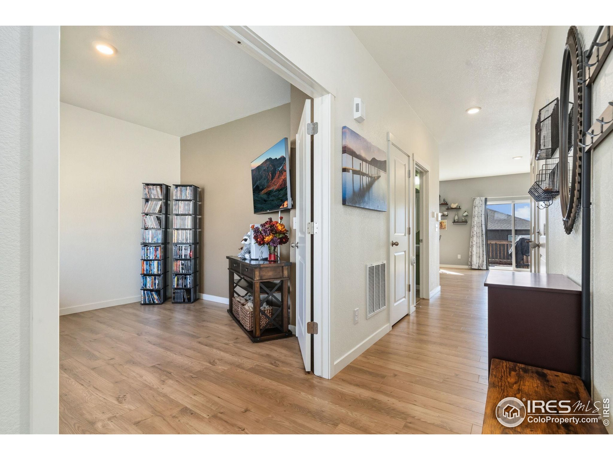 1233 Lily Mountain Road Severance, CO 80550 - Photo 5 of 44 a view of a livingroom with furniture and an empty room