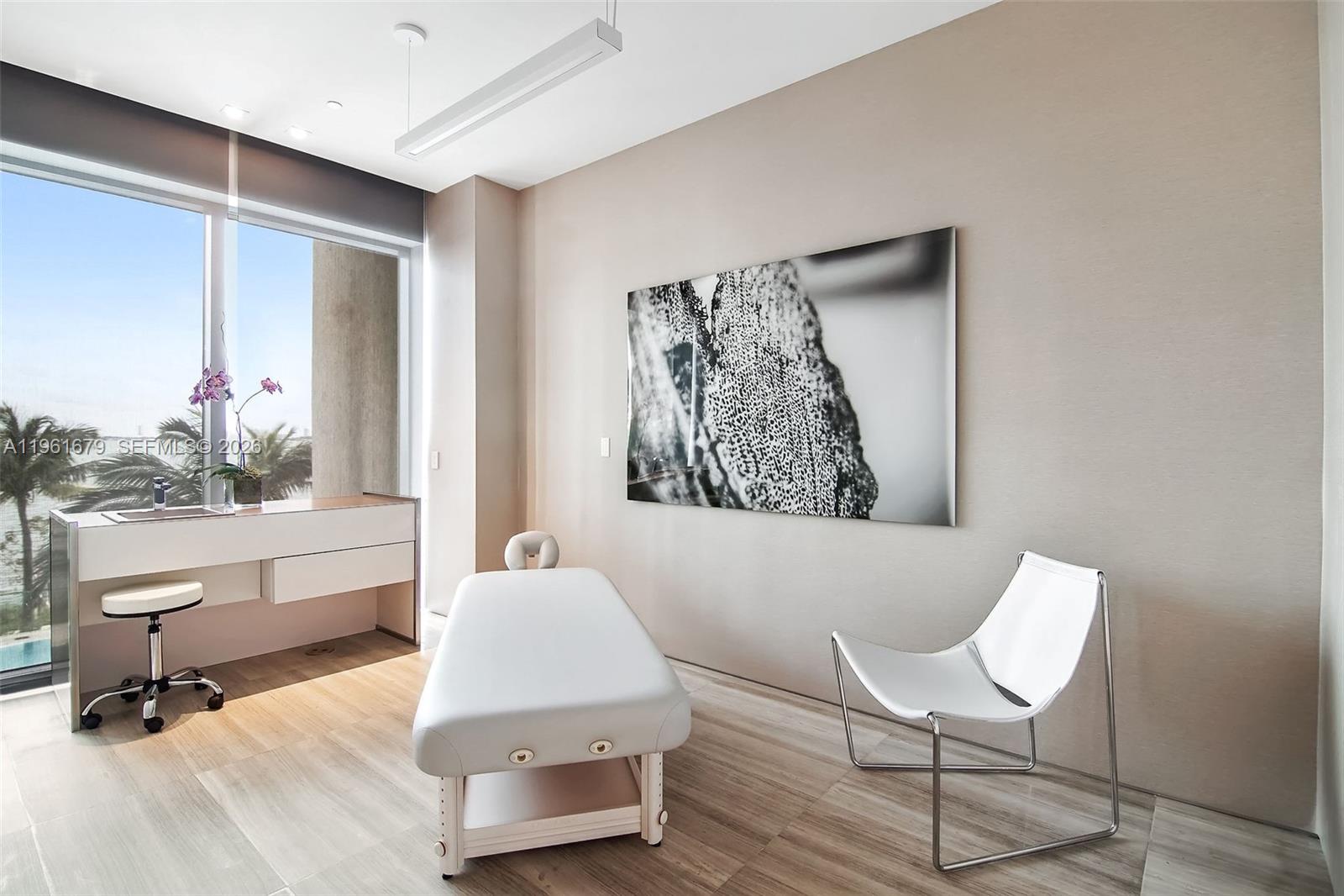 460 Northeast 28th Street, Unit 1601 Miami, FL 33137 - Photo 31 of 41 a living room with furniture and a painting on the wall