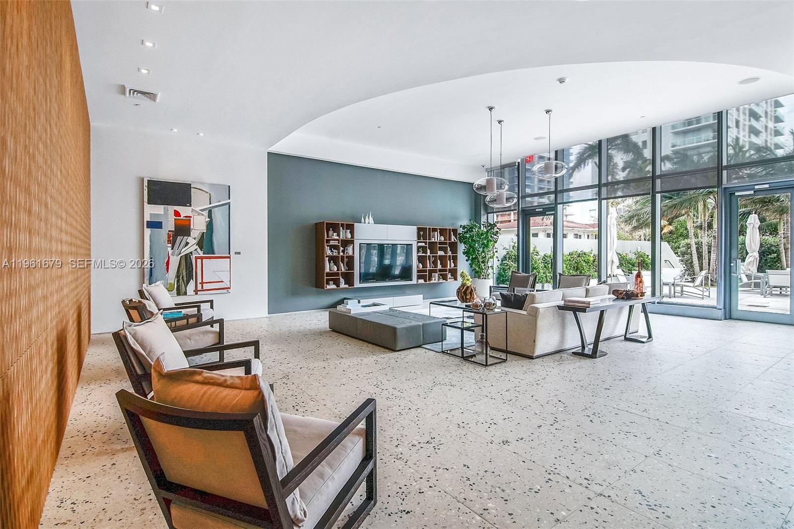 460 Northeast 28th Street, Unit 1601 Miami, FL 33137 - Photo 35 of 41 a living room with furniture and a chandelier